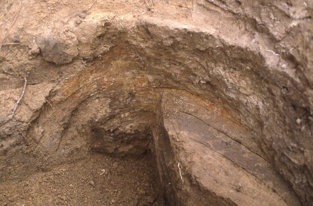 photo of partially excavated large cooking pit