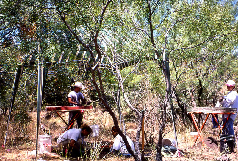 photo of archeologists setting up an excavation