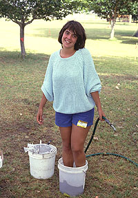 This is called getting into your work—or cooling off West Texas style. One of two teenagers whose responsibility was the processing of flotation samples.