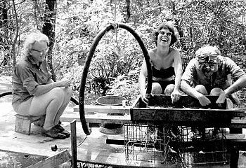 Field school participants enjoy cooling off while "bead washing." 