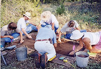 Excavators troweling in tight quarters to expose one of the features at the Graham-Applegate site. Photo by Joyce Sloan.