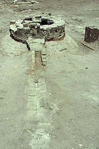 The Bozeth Cistern. Located next to the front entrance of the house, the cistern was likely covered by a front porch. Water from the roof of the house was collected through a pipe that ran into the opening on top of the cistern. An overflow spout directed excess water into the yard. Photo courtesy Hicks & Co.