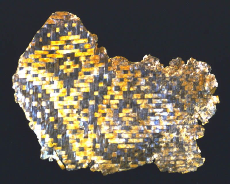 photograph of a yellow and black basket fragment