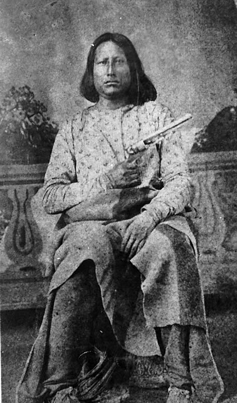 black and white photograph of a man sitting in a chair