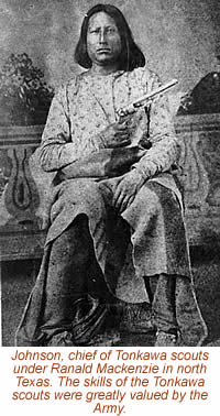 black and white photograph of a man sitting in a chair