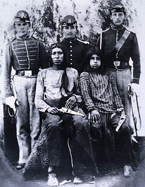 black and white photo of five people in historic clothing- portrait style