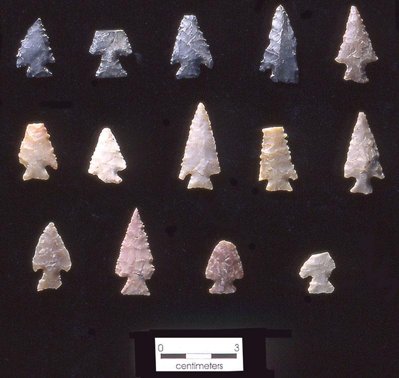 photo of arrowheads on black background