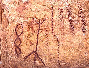 dark red abstract painting on rock wall