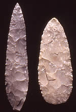 two long stone bifaces on black background