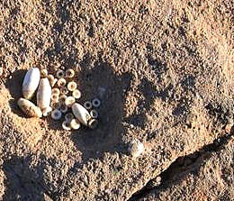 Photo of bead cache in floor of communal room.