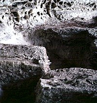 Excavations at the back of Hinds Cave. Here archeologists have isolated a block on three sides. The profiles allowed them to see the complex layering and guide their excavations accordingly, layer by layer. Photo by Phil Dering.