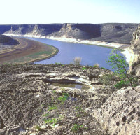 The lower Devils River valley as viewed from the high cliff housing rockshelters with pictographs. Photo by Steve Black. 