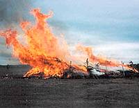 burning Caddo-style house