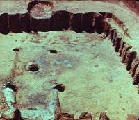 Photo of Rear and side walls of picket-wall house at Jack Allen site.